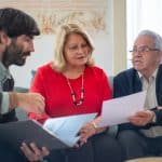 A Man Talking to the Elderly Couple